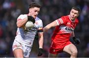 4 February 2024; Michael McKernan of Tyrone in action against Ciaran McFaul of Derry during the Allianz Football League Division 1 match between Derry and Tyrone at Celtic Park in Derry. Photo by Ramsey Cardy/Sportsfile
