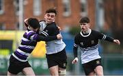 6 February 2024; Peter Murphy of Newbridge College is tackled by Cillian Mcgetrick of Terenure College during the Bank of Ireland Leinster Schools Junior Cup Round 1 match between Newbridge College and Terenure College at Energia Park in Dublin. Photo by Harry Murphy/Sportsfile
