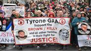 4 February 2024; Supporters parade in memory of Sean Brown and Patsy Kelly before the Allianz Football League Division 1 match between Derry and Tyrone at Celtic Park in Derry. Photo by Ramsey Cardy/Sportsfile