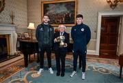 6 February 2024; The President of Ireland Michael D Higgins receives FAI President's Cup representatives Lee Grace of Shamrock Rovers, left, and Joe Redmond of St Patrick's Athletic at Áras an Uachtaráin in Dublin. On Friday 9th February, last season’s SSE Airtricity Men’s Premier Division champions Shamrock Rovers will play the 2023 Sports Direct Men’s FAI Cup winners St Patrick’s Athletic. On Saturday 2 March, 2023 Sports Direct FAI Women's Cup winners Athlone Town will play the SSE Airtricity Women's Premier Division champions Peamount United at Athlone Town Stadium. Photo by Stephen McCarthy/Sportsfile