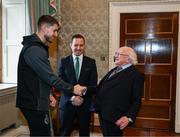 6 February 2024; The President of Ireland Michael D Higgins receives FAI President's Cup representative Lee Grace of Shamrock Rovers in the company of League of Ireland director Mark Scanlon at Áras an Uachtaráin in Dublin. On Friday 9th February, last season’s SSE Airtricity Men’s Premier Division champions Shamrock Rovers will play the 2023 Sports Direct Men’s FAI Cup winners St Patrick’s Athletic. On Saturday 2 March, 2023 Sports Direct FAI Women's Cup winners Athlone Town will play the SSE Airtricity Women's Premier Division champions Peamount United at Athlone Town Stadium. Photo by Stephen McCarthy/Sportsfile
