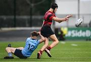 6 February 2024; Matias Quaglia of Kilkenny College offloads as he is tackled by James McMahon of St Michaels College during the Bank of Ireland Leinster Schools Junior Cup Round 1 match between Kilkenny College and St Michael's College at Energia Park in Dublin. Photo by Harry Murphy/Sportsfile