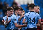 6 February 2024; Matthew McCarthy of St Michaels College, centre, celebrates with teammates after scoring his side's third try during the Bank of Ireland Leinster Schools Junior Cup Round 1 match between Kilkenny College and St Michael's College at Energia Park in Dublin. Photo by Harry Murphy/Sportsfile