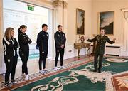 6 February 2024; Tommy Martin of The President of Ireland's aide-de-camp office, with, from left, Laurie Ryan of Athlone Town, Karen Duggan of Peamount United, Joe Redmond of St Patrick's Athletic and Lee Grace of Shamrock Rovers during a tour of Áras an Uachtaráin after FAI President's Cup representatives were received by The President of Ireland Michael D Higgins at Áras an Uachtaráin in Dublin. On Friday 9th February, last season’s SSE Airtricity Men’s Premier Division champions Shamrock Rovers will play the 2023 Sports Direct Men’s FAI Cup winners St Patrick’s Athletic. On Saturday 2 March, 2023 Sports Direct FAI Women's Cup winners Athlone Town will play the SSE Airtricity Women's Premier Division champions Peamount United at Athlone Town Stadium. Photo by Stephen McCarthy/Sportsfile
