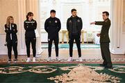 6 February 2024; Tommy Martin of The President of Ireland's aide-de-camp office, with, from left, Laurie Ryan of Athlone Town, Karen Duggan of Peamount United, Joe Redmond of St Patrick's Athletic and Lee Grace of Shamrock Rovers during a tour of Áras an Uachtaráin after FAI President's Cup representatives were received by The President of Ireland Michael D Higgins at Áras an Uachtaráin in Dublin. On Friday 9th February, last season’s SSE Airtricity Men’s Premier Division champions Shamrock Rovers will play the 2023 Sports Direct Men’s FAI Cup winners St Patrick’s Athletic. On Saturday 2 March, 2023 Sports Direct FAI Women's Cup winners Athlone Town will play the SSE Airtricity Women's Premier Division champions Peamount United at Athlone Town Stadium. Photo by Stephen McCarthy/Sportsfile