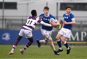 8 February 2024; Eoin Farrell of St Mary’s College is tackled by Bernard Ibirogba of Clongowes Wood College during the Bank of Ireland Leinster Schools Junior Cup Round 1 match between St Mary's College and Clongowes Wood College at Energia Park in Dublin. Photo by Daire Brennan/Sportsfile