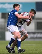 8 February 2024; Fionn Doyle of Clongowes Wood College is tackled by Will Kelly of St Mary’s College during the Bank of Ireland Leinster Schools Junior Cup Round 1 match between St Mary's College and Clongowes Wood College at Energia Park in Dublin. Photo by Daire Brennan/Sportsfile