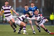 8 February 2024; Tom O’Keefe of St Mary’s College is tackled by Ben Brady, left, and Tom English of Clongowes Wood College during the Bank of Ireland Leinster Schools Junior Cup Round 1 match between St Mary's College and Clongowes Wood College at Energia Park in Dublin. Photo by Daire Brennan/Sportsfile