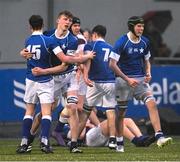 8 February 2024; St Mary's College players, left to right, Will Kelly, Eoin Farrell, and Simon Egan celebrate their side's fifth try during the Bank of Ireland Leinster Schools Junior Cup Round 1 match between St Mary's College and Clongowes Wood College at Energia Park in Dublin. Photo by Daire Brennan/Sportsfile