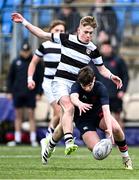 9 February 2024; Joshua Ellis of Wesley College is tackled by David Barr of Belvedere College during Bank of Ireland Leinster Schools Junior Cup Round 1 match between Belvedere College and Wesley College at Energia Park in Dublin. Photo by Piaras Ó Mídheach/Sportsfile