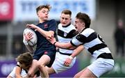 9 February 2024; Zach Sidebottom of Wesley College in action against Fionn McMahon, left, and Charlie Whelan of Belvedere College during Bank of Ireland Leinster Schools Junior Cup Round 1 match between Belvedere College and Wesley College at Energia Park in Dublin. Photo by Piaras Ó Mídheach/Sportsfile