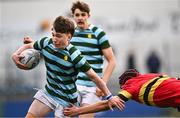 9 February 2024; Brodie McNeill of St Gerard's School in action against JJ Cormican of CBC Monkstown during Bank of Ireland Leinster Schools Junior Cup Round 1 match between CBC Monkstown and St Gerard's School at Energia Park in Dublin. Photo by Piaras Ó Mídheach/Sportsfile