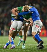 9 February 2024; Hugh Gavin of Ireland is tackled by Federico Zanandrea, left, and Luca Bellucci of Italy during the U20 Six Nations Rugby Championship match between Ireland and Italy at Virgin Media Park in Cork. Photo by Brendan Moran/Sportsfile