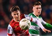 9 February 2024; Jay McClelland of St Patrick's Athletic in action against Darragh Burns of Shamrock Rovers during the 2024 Men's President's Cup match between Shamrock Rovers and St Patrick's Athletic at Tallaght Stadium in Dublin. Photo by Stephen McCarthy/Sportsfile