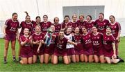 10 February 2024; Marino captain Kate McClusky holds the cup aloft as she celebrates with team-mates after their victory in the Electric Ireland Ashling Murphy Cup final match between Ulster University Magee and Marino at University of Galway Connacht GAA Centre of Excellence in Bekan, Mayo. Photo by Piaras Ó Mídheach/Sportsfile