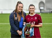 10 February 2024; Chairperson of Third Level Camogie Shauna Fitzgerald presents Marino captain Kate McClusky with the cup after the Electric Ireland Ashling Murphy Cup final match between Ulster University Magee and Marino at University of Galway Connacht GAA Centre of Excellence in Bekan, Mayo. Photo by Piaras Ó Mídheach/Sportsfile