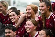 10 February 2024; Katie Burke of Marino, back-centre, celebrates with team-mates after their side's victory in the Electric Ireland Ashling Murphy Cup final match between Ulster University Magee and Marino at University of Galway Connacht GAA Centre of Excellence in Bekan, Mayo. Photo by Piaras Ó Mídheach/Sportsfile