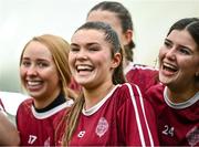 10 February 2024; Marino players, from left, Katie Burke, Kate McClusky and Róisín Dullea celebrate after their side's victory in the Electric Ireland Ashling Murphy Cup final match between Ulster University Magee and Marino at University of Galway Connacht GAA Centre of Excellence in Bekan, Mayo. Photo by Piaras Ó Mídheach/Sportsfile