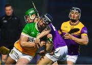 10 February 2024; Jason Sampson of Offaly in action against Richie Lawlor of Wexford during the Allianz Hurling League Division 1 Group A match between Wexford and Offaly at Chadwicks Wexford Park in Wexford. Photo by Tyler Miller/Sportsfile