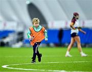 10 February 2024; University of Galway waterboy Iarlaith De Barra, age 8, runs to the pitch with a water bottle during a break in the Electric Ireland Uí Mhaolagáin Cup final match between University of Limerick and University of Galway at University of Galway Connacht GAA Centre of Excellence in Bekan, Mayo. Photo by Piaras Ó Mídheach/Sportsfile