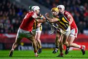 10 February 2024; Billy Ryan of Kilkenny is tackled by Tim O’Mahony, left, and Eoin Roche of Cork during the Allianz Hurling League Division 1 Group A match between Cork and Kilkenny at SuperValu Páirc Ui Chaoimh in Cork. Photo by Eóin Noonan/Sportsfile