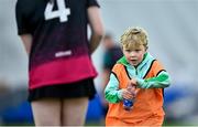 10 February 2024; University of Galway waterboy Iarlaith De Barra, age 8, runs to the pitch with a water bottle during a break in the Electric Ireland Uí Mhaolagáin Cup final match between University of Limerick and University of Galway at University of Galway Connacht GAA Centre of Excellence in Bekan, Mayo. Photo by Piaras Ó Mídheach/Sportsfile