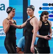 11 February 2024; Team Ireland, from left, Maria Godden and Grace Davison and Erin Riordan after their heat of Women's 4x100m freestyle relay on day one of the World Aquatics Championships 2024 at the Aspire Dome in Doha, Qatar. Photo by Ian MacNicol/Sportsfile