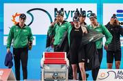 11 February 2024; Team Ireland, from left, Victoria Catterson, Grace Davison, Erin Riordan, and Maria Godden before their heat of Women's 4x100m freestyle relay on day one of the World Aquatics Championships 2024 at the Aspire Dome in Doha, Qatar. Photo by Ian MacNicol/Sportsfile
