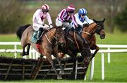 11 February 2024; Runners and riders, from left, Angostura, with Jack Kennedy up, Ascending, with Darragh O'Keeffe up, and Gaucher, with Paul Townend up, jump the last during the Navan Ford and Opel Maiden Hurdle at Navan Racecourse in Meath. Photo by Seb Daly/Sportsfile