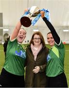 11 February 2024; Queens University Belfast joint captains Hannah Dorrian, left, and Aine Graham are presented with the Fr Meaghair Cup by Camogie Association President, Hilda Breslin, centre, after their side's victory in the Electric Ireland Cup final match between Queens University Belfast and Ulster University Jordanstown at University of Galway Connacht GAA Centre of Excellence in Bekan, Mayo. Photo by Sam Barnes/Sportsfile