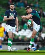 11 February 2024; Jack Crowley of Ireland, right, and team-mate Harry Byrne warm-up before the Guinness Six Nations Rugby Championship match between Ireland and Italy at the Aviva Stadium in Dublin. Photo by Brendan Moran/Sportsfile