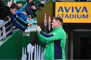 11 February 2024; Tadhg Furlong of Ireland signs autographs for supporters before the Guinness Six Nations Rugby Championship match between Ireland and Italy at the Aviva Stadium in Dublin. Photo by Ben McShane/Sportsfile