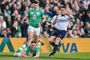 11 February 2024; Jack Crowley of Ireland dives over to score his side's first try during the Guinness Six Nations Rugby Championship match between Ireland and Italy at the Aviva Stadium in Dublin. Photo by Ben McShane/Sportsfile