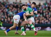 11 February 2024; Robbie Henshaw of Ireland is tackled by Lorenzo Pani, left, and Tommaso Menoncello of Italy during the Guinness Six Nations Rugby Championship match between Ireland and Italy at the Aviva Stadium in Dublin. Photo by Piaras Ó Mídheach/Sportsfile