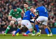 11 February 2024; Finlay Bealham of Ireland is tackled by Federico Ruzza, left, and Pietro Ceccarelli of Italy during the Guinness Six Nations Rugby Championship match between Ireland and Italy at the Aviva Stadium in Dublin. Photo by Ben McShane/Sportsfile