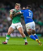 11 February 2024; Craig Casey of Ireland is tackled by Monty Ioane of Italy during the Guinness Six Nations Rugby Championship match between Ireland and Italy at the Aviva Stadium in Dublin. Photo by Brendan Moran/Sportsfile