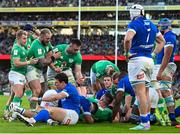 11 February 2024; Jack Conan of Ireland, right, celebrates with team-mates Andrew Porter, middle, and Craig Casey, as they assist team-mate Dan Sheehan after scoring their side's third try during the Guinness Six Nations Rugby Championship match between Ireland and Italy at the Aviva Stadium in Dublin. Photo by Ben McShane/Sportsfile