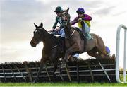 11 February 2024; Aodhan May, left, with Philip Byrnes up, jumps the last on their way to winning the Gibney's Handicap Hurdle, from eventual third place Clear The Clouds, right, with Conor Stone-Walsh up,  at Navan Racecourse in Meath. Photo by Seb Daly/Sportsfile