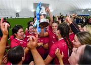 11 February 2024; University of Galway players celebrate with the cup after their side's victory in the Electric Ireland Purcell Cup final match between University of Galway and SETU Carlow at University of Galway Connacht GAA AirDome in Bekan, Mayo. Photo by Sam Barnes/Sportsfile