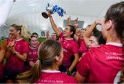 11 February 2024; University of Galway players, including joint captain Fiona Ryan, centre, celebrate with the cup after their side's victory in the Electric Ireland Purcell Cup final match between University of Galway and SETU Carlow at University of Galway Connacht GAA AirDome in Bekan, Mayo. Photo by Sam Barnes/Sportsfile