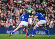 11 February 2024; Stuart McCloskey of Ireland is tackled by Tommaso Menoncello of Italy during the Guinness Six Nations Rugby Championship match between Ireland and Italy at the Aviva Stadium in Dublin. Photo by Piaras Ó Mídheach/Sportsfile