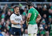 11 February 2024; Referee Luke Pearce speaks with Ireland captain Caelan Doris during the Guinness Six Nations Rugby Championship match between Ireland and Italy at the Aviva Stadium in Dublin. Photo by Brendan Moran/Sportsfile