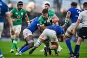 11 February 2024; Joe McCarthy of Ireland is tackled by Alessandro Izekor, left, and Gianmarco Lucchesi of Italy during the Guinness Six Nations Rugby Championship match between Ireland and Italy at the Aviva Stadium in Dublin. Photo by Brendan Moran/Sportsfile