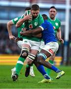 11 February 2024; Iain Henderson of Ireland is tackled by Alessandro Izekor of Italy during the Guinness Six Nations Rugby Championship match between Ireland and Italy at the Aviva Stadium in Dublin. Photo by Brendan Moran/Sportsfile