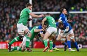 11 February 2024; Juan Ignacio Brex of Italy is tackled by Harry Byrne, left, and Jordan Larmour of Ireland during the Guinness Six Nations Rugby Championship match between Ireland and Italy at the Aviva Stadium in Dublin. Photo by Ben McShane/Sportsfile