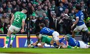 11 February 2024; Calvin Nash of Ireland dives over to score his side's sixth try despite the efforts of Martin Page-Relo of Italy during the Guinness Six Nations Rugby Championship match between Ireland and Italy at the Aviva Stadium in Dublin. Photo by Brendan Moran/Sportsfile