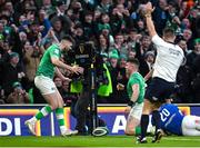 11 February 2024; Calvin Nash of Ireland, right, celebrates with team-mate Harry Byrne after scoring their side's sixth try as referee Luke Pearce signals during the Guinness Six Nations Rugby Championship match between Ireland and Italy at the Aviva Stadium in Dublin. Photo by Brendan Moran/Sportsfile