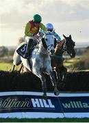 11 February 2024; Young Dev, left, with Daniel King up, jumps the last on their way to winning the William Hill Handicap Steeplechase, from eventual second place Rolly Bowley Boy, right, with Eoin Walsh up, at Navan Racecourse in Meath. Photo by Seb Daly/Sportsfile
