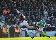 11 February 2024; Barry Nash of Limerick gets a shot off despite the attention of Tommy Doyle of Westmeath during the Allianz Hurling League Division 1 Group B match between Westmeath and Limerick at TEG Cusack Park in Mullingar, Westmeath. Photo by Michael P Ryan/Sportsfile