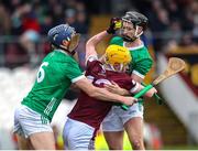 11 February 2024; David O'Reilly of Westmeath in action against Limerick players David Reidy, left, and Michael Daly during the Allianz Hurling League Division 1 Group B match between Westmeath and Limerick at TEG Cusack Park in Mullingar, Westmeath. Photo by Michael P Ryan/Sportsfile
